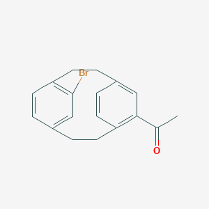 molecular formula C18H17BrO B100333 1-(11-Bromo-5-tricyclo[8.2.2.24,7]hexadeca-1(12),4,6,10,13,15-hexaenyl)ethanone CAS No. 18931-44-7