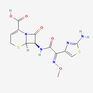 B10761383 7-[2-(2-Amino-thiazol-4-yl)-2-methoxyimino-acetylamino]-8-oxo-5-thia-1-aza-bicyclo[4.2.0]oct-2-ene-2-carboxylic acid CAS No. 68403-31-6