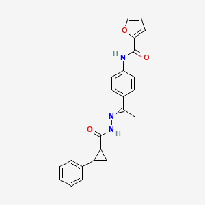 molecular formula C23H21N3O3 B10796749 N-[4-[C-methyl-N-[(2-phenylcyclopropanecarbonyl)amino]carbonimidoyl]phenyl]furan-2-carboxamide 