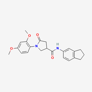 molecular formula C22H24N2O4 B11012690 N-(2,3-dihydro-1H-inden-5-yl)-1-(2,4-dimethoxyphenyl)-5-oxopyrrolidine-3-carboxamide 