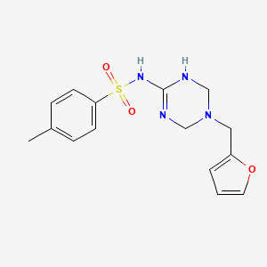 molecular formula C15H18N4O3S B11030585 N-[5-(furan-2-ylmethyl)-1,4,5,6-tetrahydro-1,3,5-triazin-2-yl]-4-methylbenzenesulfonamide 