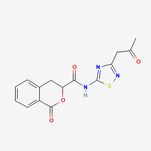 molecular formula C15H13N3O4S B11067457 1-oxo-N-[3-(2-oxopropyl)-1,2,4-thiadiazol-5-yl]-3,4-dihydro-1H-isochromene-3-carboxamide 