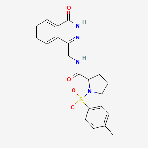 molecular formula C21H22N4O4S B11069399 1-[(4-Methylphenyl)sulfonyl]-N-[(4-oxo-3,4-dihydro-1-phthalazinyl)methyl]prolinamide 