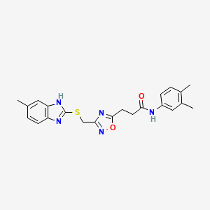 N-(3,4-dimethylphenyl)-3-(3-{[(5-methyl-1H-benzimidazol-2-yl)sulfanyl]methyl}-1,2,4-oxadiazol-5-yl)propanamide