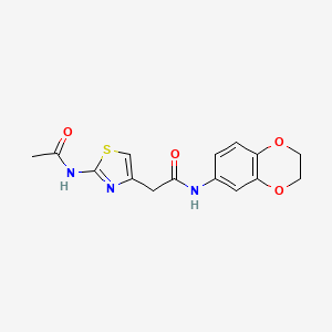 molecular formula C15H15N3O4S B11279724 2-(2-acetamidothiazol-4-yl)-N-(2,3-dihydrobenzo[b][1,4]dioxin-6-yl)acetamide 