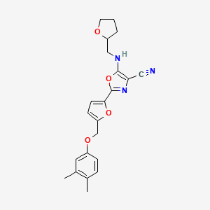 2-{5-[(3,4-Dimethylphenoxy)methyl]furan-2-yl}-5-[(tetrahydrofuran-2-ylmethyl)amino]-1,3-oxazole-4-carbonitrile