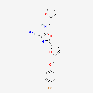 2-{5-[(4-Bromophenoxy)methyl]furan-2-yl}-5-[(tetrahydrofuran-2-ylmethyl)amino]-1,3-oxazole-4-carbonitrile