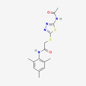 molecular formula C15H18N4O2S2 B11383387 2-[(5-acetamido-1,3,4-thiadiazol-2-yl)sulfanyl]-N-(2,4,6-trimethylphenyl)acetamide 