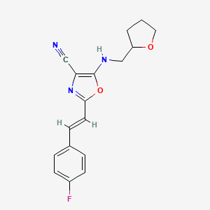 2-[(E)-2-(4-fluorophenyl)ethenyl]-5-[(tetrahydrofuran-2-ylmethyl)amino]-1,3-oxazole-4-carbonitrile