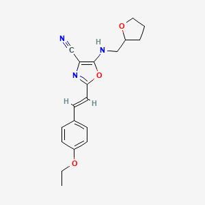 2-[(E)-2-(4-ethoxyphenyl)ethenyl]-5-[(tetrahydrofuran-2-ylmethyl)amino]-1,3-oxazole-4-carbonitrile