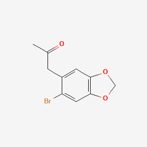 B1141784 1-(6-Bromobenzo[d][1,3]dioxol-5-yl)propan-2-one CAS No. 43197-28-0
