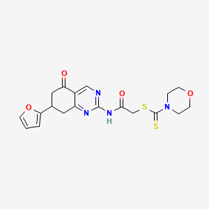 molecular formula C19H20N4O4S2 B11455250 2-{[7-(Furan-2-yl)-5-oxo-5,6,7,8-tetrahydroquinazolin-2-yl]amino}-2-oxoethyl morpholine-4-carbodithioate 