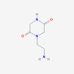 molecular formula C6H11N3O2 B115420 1-(2-Aminoethyl)piperazine-2,5-dione CAS No. 143411-80-7