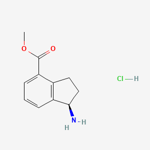 molecular formula C11H14ClNO2 B11731925 Methyl (1R)-1-amino-2,3-dihydro-1H-indene-4-carboxylate hydrochloride 