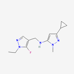 molecular formula C13H18FN5 B11739886 3-cyclopropyl-N-[(1-ethyl-5-fluoro-1H-pyrazol-4-yl)methyl]-1-methyl-1H-pyrazol-5-amine 