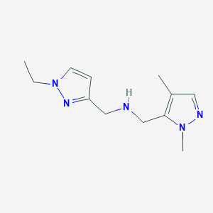 molecular formula C12H19N5 B11741957 [(1,4-dimethyl-1H-pyrazol-5-yl)methyl][(1-ethyl-1H-pyrazol-3-yl)methyl]amine 