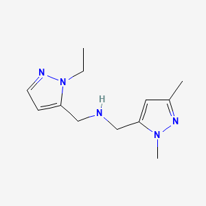 molecular formula C12H19N5 B11742325 [(1,3-dimethyl-1H-pyrazol-5-yl)methyl][(1-ethyl-1H-pyrazol-5-yl)methyl]amine 