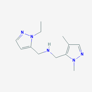 molecular formula C12H19N5 B11743092 [(1,4-dimethyl-1H-pyrazol-5-yl)methyl][(1-ethyl-1H-pyrazol-5-yl)methyl]amine 