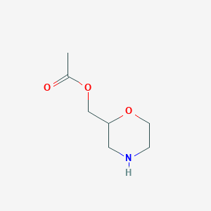 molecular formula C7H13NO3 B11743504 2-Morpholinemethanol, 2-acetate CAS No. 1078708-74-3