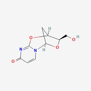 molecular formula C9H10N2O4 B11743579 (1R,9S,10R)-10-(hydroxymethyl)-8,11-dioxa-2,6-diazatricyclo[7.2.1.02,7]dodeca-3,6-dien-5-one 