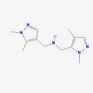 molecular formula C12H19N5 B11744629 [(1,5-dimethyl-1H-pyrazol-4-yl)methyl][(1,4-dimethyl-1H-pyrazol-5-yl)methyl]amine 