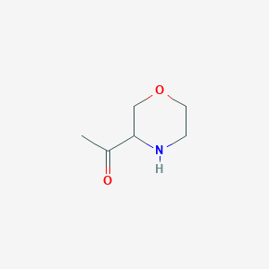 molecular formula C6H11NO2 B11748304 1-(Morpholin-3-yl)ethan-1-one 