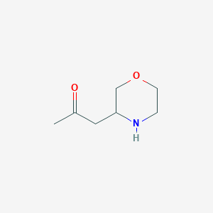 molecular formula C7H13NO2 B11749283 1-(Morpholin-3-yl)propan-2-one 