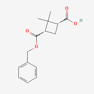 molecular formula C15H18O4 B11767136 (1R,3S)-3-[(benzyloxy)carbonyl]-2,2-dimethylcyclobutane-1-carboxylic acid CAS No. 1616705-62-4