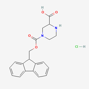 4-(((9H-Fluoren-9-yl)methoxy)carbonyl)piperazine-2-carboxylic acid hydrochloride