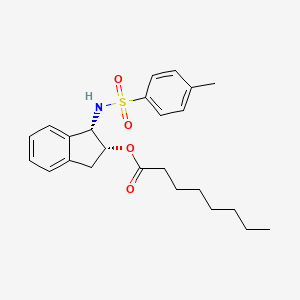 Octanoic acid, (1S,2R)-2,3-dihydro-1-[[(4-methylphenyl)sulfonyl]amino]-1H-inden-2-yl ester