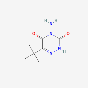B1194530 1,2,4-Triazine-3,5(2H,4H)-dione, 4-amino-6-(1,1-dimethylethyl)- CAS No. 56507-37-0