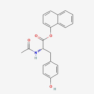 B1198794 N-Acetyltyrosine 1-naphthyl ester CAS No. 71258-95-2