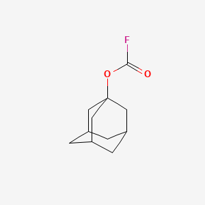 B1201870 1-Adamantyl fluoroformate CAS No. 62087-82-5