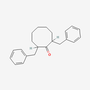 B1202825 2,8-Dibenzylcyclooctanone CAS No. 38104-15-3