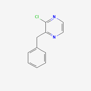 Pyrazine, 2-chloro-3-(phenylmethyl)-