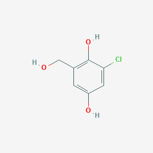 molecular formula C7H7ClO3 B1209190 Benzyl alcohol, 3-chloro-2,5-dihydroxy- 
