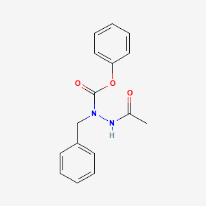 B1213246 N-Acetyl-alpha-azaphenylalanine phenyl ester CAS No. 53370-82-4
