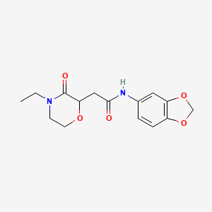 molecular formula C15H18N2O5 B12138475 N-(1,3-benzodioxol-5-yl)-2-(4-ethyl-3-oxomorpholin-2-yl)acetamide 