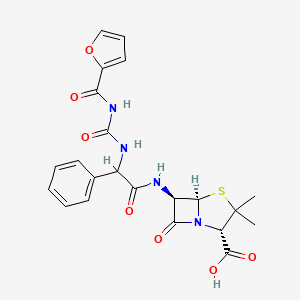 molecular formula C22H22N4O7S B1215297 (2S,5R,6R)-6-[[2-(furan-2-carbonylcarbamoylamino)-2-phenylacetyl]amino]-3,3-dimethyl-7-oxo-4-thia-1-azabicyclo[3.2.0]heptane-2-carboxylic acid CAS No. 54661-82-4