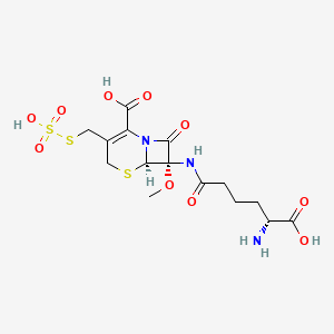molecular formula C15H21N3O10S3 B1216186 (6R,7S)-7-[[(5R)-5-amino-5-carboxypentanoyl]amino]-7-methoxy-8-oxo-3-(sulfosulfanylmethyl)-5-thia-1-azabicyclo[4.2.0]oct-2-ene-2-carboxylic acid CAS No. 56487-86-6