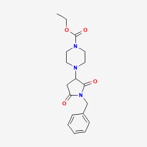 molecular formula C18H23N3O4 B12208869 Ethyl 4-(1-benzyl-2,5-dioxopyrrolidin-3-yl)piperazine-1-carboxylate 