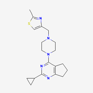 1-{2-cyclopropyl-5H,6H,7H-cyclopenta[d]pyrimidin-4-yl}-4-[(2-methyl-1,3-thiazol-4-yl)methyl]piperazine