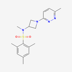 molecular formula C18H24N4O2S B12241898 N,2,4,6-tetramethyl-N-[1-(6-methylpyridazin-3-yl)azetidin-3-yl]benzene-1-sulfonamide 