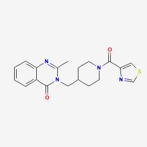 molecular formula C19H20N4O2S B12242846 2-Methyl-3-{[1-(1,3-thiazole-4-carbonyl)piperidin-4-yl]methyl}-3,4-dihydroquinazolin-4-one 