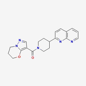 2-(1-{5H,6H,7H-pyrazolo[3,2-b][1,3]oxazine-3-carbonyl}piperidin-4-yl)-1,8-naphthyridine