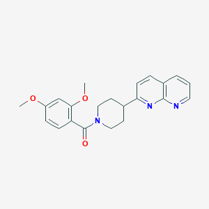 molecular formula C22H23N3O3 B12248941 2-[1-(2,4-Dimethoxybenzoyl)piperidin-4-yl]-1,8-naphthyridine 