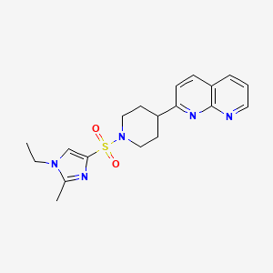 molecular formula C19H23N5O2S B12249462 2-{1-[(1-ethyl-2-methyl-1H-imidazol-4-yl)sulfonyl]piperidin-4-yl}-1,8-naphthyridine 