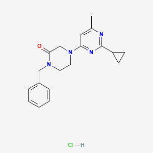 molecular formula C19H23ClN4O B12263483 1-Benzyl-4-(2-cyclopropyl-6-methylpyrimidin-4-yl)piperazin-2-one hydrochloride 