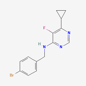 molecular formula C14H13BrFN3 B12266222 N-[(4-bromophenyl)methyl]-6-cyclopropyl-5-fluoropyrimidin-4-amine 