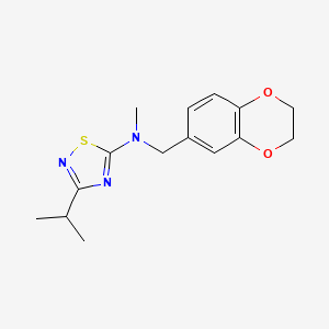 molecular formula C15H19N3O2S B12267095 N-[(2,3-dihydro-1,4-benzodioxin-6-yl)methyl]-N-methyl-3-(propan-2-yl)-1,2,4-thiadiazol-5-amine 